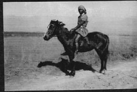Circa 1925. Young black person on horseback. (Album on Natal electrification)