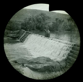 Soldiers crossing weir during Anglo-Boer War.