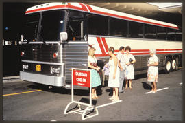 Durban, 1968. SAR MCI tour bus with passengers. Motor Coach Industries (MCI) bus. Road registrati...