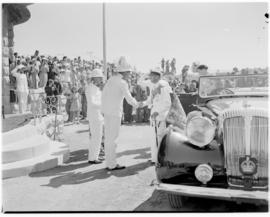 Maseru, Basutoland, 12 March 1947. King George VI exits the royal car and is greeted by uniformed...