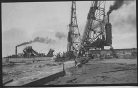 Walvis Bay, 1925. Driving piles during construction of harbour.