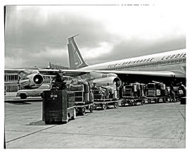 
SAA Boeing 707, luggage being towed away.
