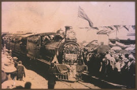 George, 20 July 1907. Decorated train entering railway station from Mossel Bay with headboard 'Fr...