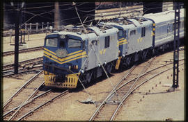Johannesburg. A pair of SAR Class 6E1 Srs 6 on train No 2221down hauling new Blue Train into rail...