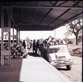 Komatipoort, 1963. Thames Trader truck unloading vegetables at station.