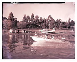Virginia district, 1961. Boating on Allemanskraal Dam in Willem Pretorius game reserve.