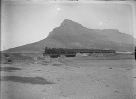 Cape Town. SAR Class 05, earlier CGR 5th Class, with suburban train crossing a low steel bridge w...