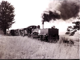 Estcourt district, 1964. Driver Billy Bester and SAR Class NGG11 No 55 posing for the photographe...