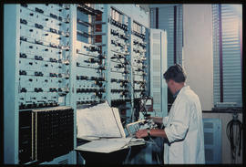 Johannesburg, 1974. Electrical technician at large control panel.