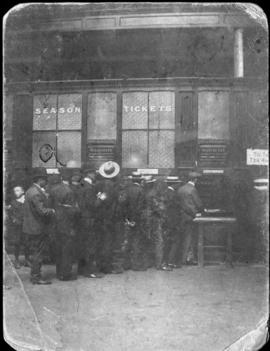 Cape Town, 1903. Customers queuing at station season ticket office.