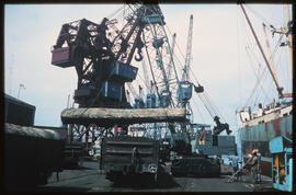 Durban, 1972. Unloading heavy timber by crane in Durban Harbour.