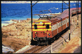 Cape Town, 1990. SAR type 5M2A on suburban train No 204 between Glencairn and Sunny Cove on the C...