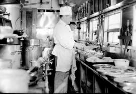 Chef at work in dining car kitchen of the Union Limited.