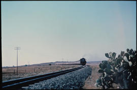 
Passenger train in open country.
