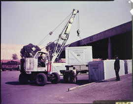 Loading of portable SAR container with mobile crane.