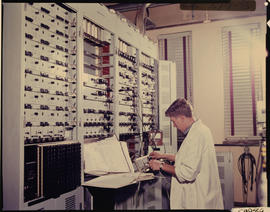 Johannesburg, 1974. Electrical technician at large control panel.