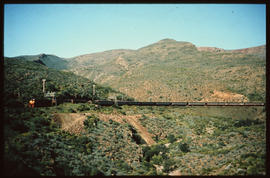 
Passenger train in mountainous country.
