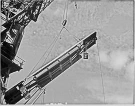Port Elizabeth, 1948. Steel platform lifted by crane in Port Elizabeth harbour.