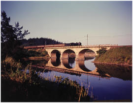 Natal South Coast. Train on bridge over river.