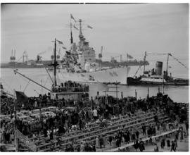 Cape Town. 24 April 1947. 'HMS Vanguard' and SAR tug 'John X Merriman' pull out of Table Bay Harb...