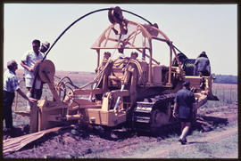 Cable laying machine at work. Caterpillar D7 crawler tractor.