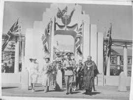 Bulawayo, Southern Rhodesia, 15 April 1947. Royal family walking through walkway in the company o...