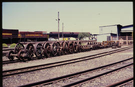 Wheel sets in railway yard.