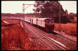 Johannesburg, 1972. SAR Class 5E1 Srs 2 with Trans-Karoo passenger train near Lawley.