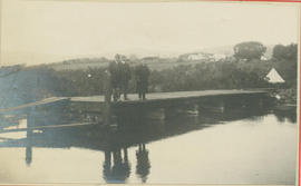 Hermanus district. Men standing at causeway at the Afdak River.