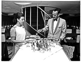 
SAA Boeing 747 interior. Cabin service. Steward and hostess.
