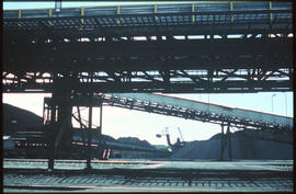 Richards Bay, November 1979. Coal stockpiles and conveyor belts at Richards Bay Harbour. [De Waal...