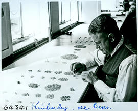 "Kimberley, 1956. Classifying diamonds."