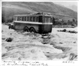 SAR Thornycroft three-axle bus with roof rack at the back crossing Tugela River in the Royal Nata...