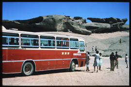 
SAR tour bus and passengers at stone formations. Jaws to identify.
