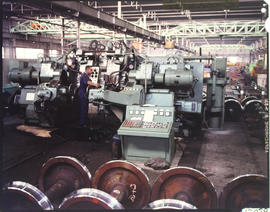Fitters and turners in wheel turning workshop.
