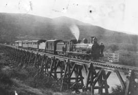 Inciba, circa 1902. CGR 5th Class Dubs hauling a mixed goods train  wooden trestle bridge.