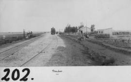 Border, 1895. Train hauled by Cape 1st Class 1879 and station buildings in the distance. (EH Short)