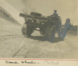 Lorry fitted with sand wheels.