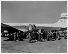 Circa 1960. Departure of SAA Douglas DC-7B ZS-DKG 'Chapman' to London, passengers embarking.
