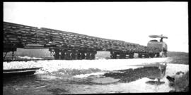 Naboomspruit district, 1924. SAR Dutton roadrail tractor hauling construction train with track pa...