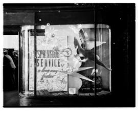 Circa 1949. SAA Advert in window 'It’s a long way faster by Skymaster'.
