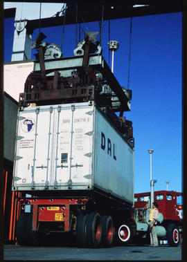 Johannesburg, 1982. Overhead crane loading container onto truck at Kaserne container depot.