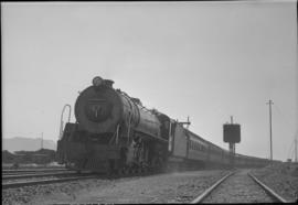 SAR Class 15CA locomotive leaving country station.