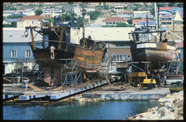 Mossel Bay, February 1987. Ship being repaired on ramp in Mossel Bay Harbour. [T Robberts]