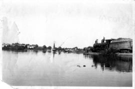 Upington, 1923. Orange River flood damage. Pumping water.