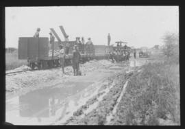 SAR Dutton roadrail tractor with ballast train.