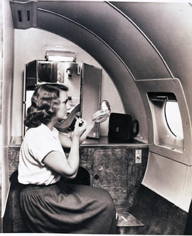 
BOAC Handley Page Hermes interior. Lady in powder room.
