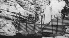 Wilderness, circa 1926. Kaaimans River bridge construction: Construction of concrete wall across ...