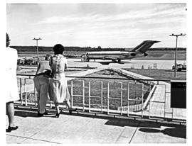 East London, 1975. Ben Schoeman airport. SAA Boeing 727 ZS-SBF 'Komati' being watched from the vi...