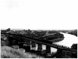 Colenso, March 1958. Train on bridge over the Tugela river with partly dismantled old bridge alon...